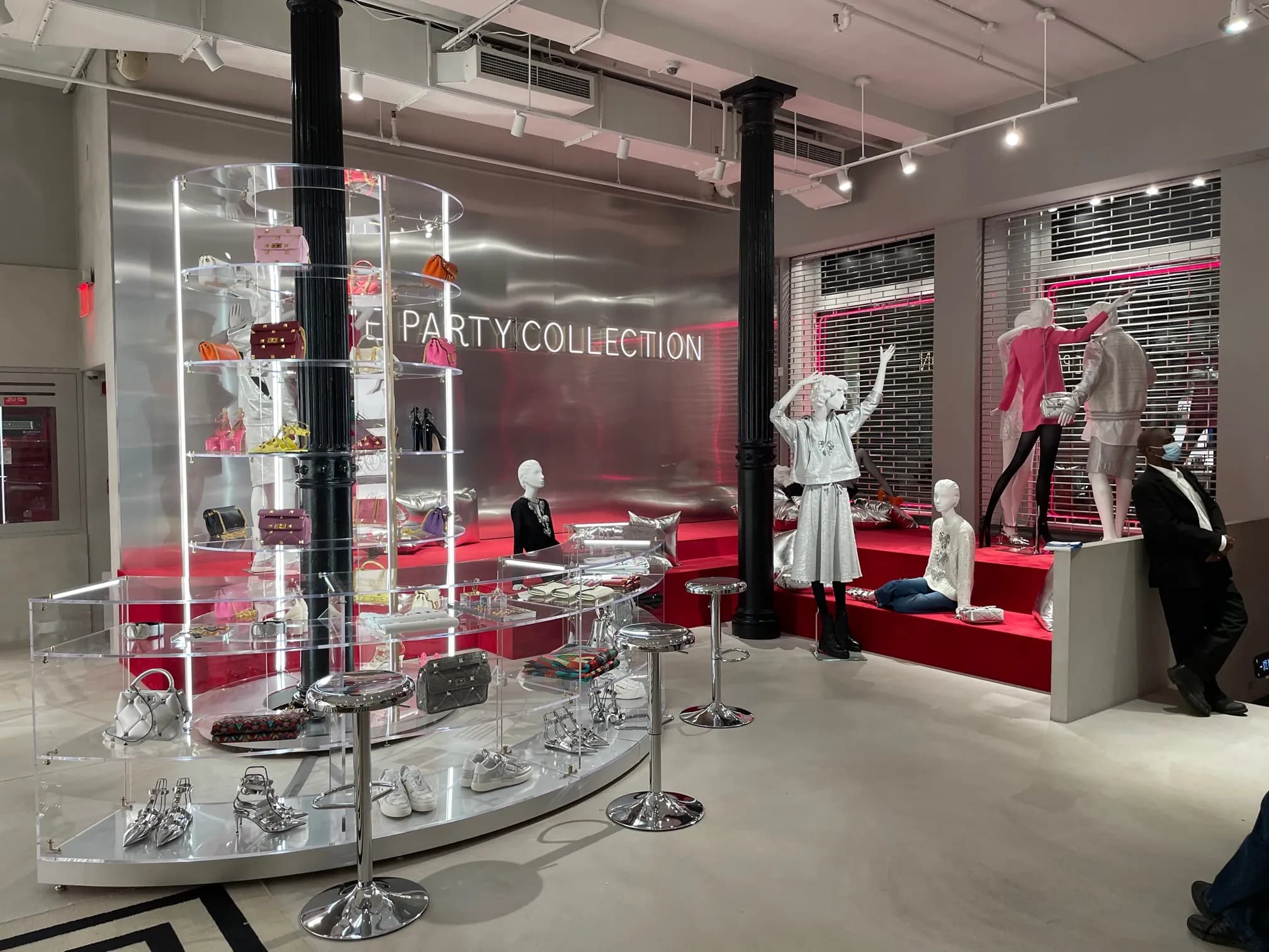 Valentino Party Collection Soho takeover with mirrored acrylic displays, silver walls and red seating