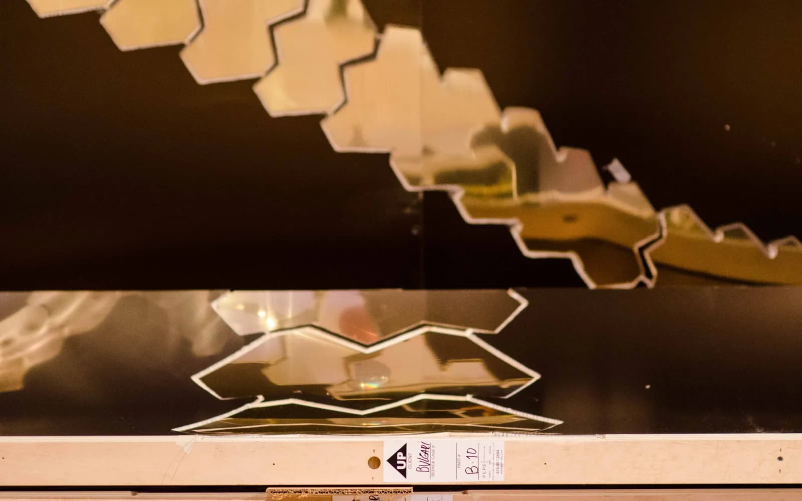 Fabricated mirrored Serpenti scale elements before installation
