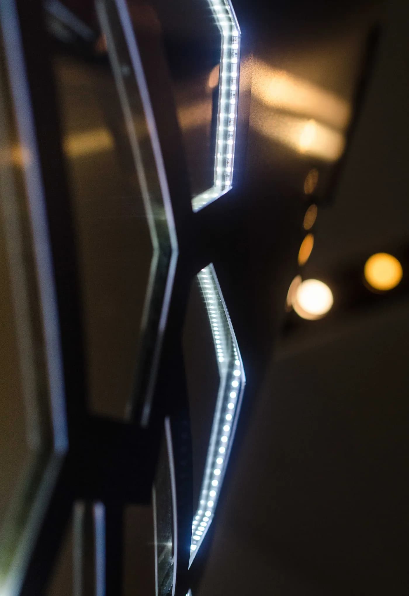 Detail of LED-edged mirrored scale panels