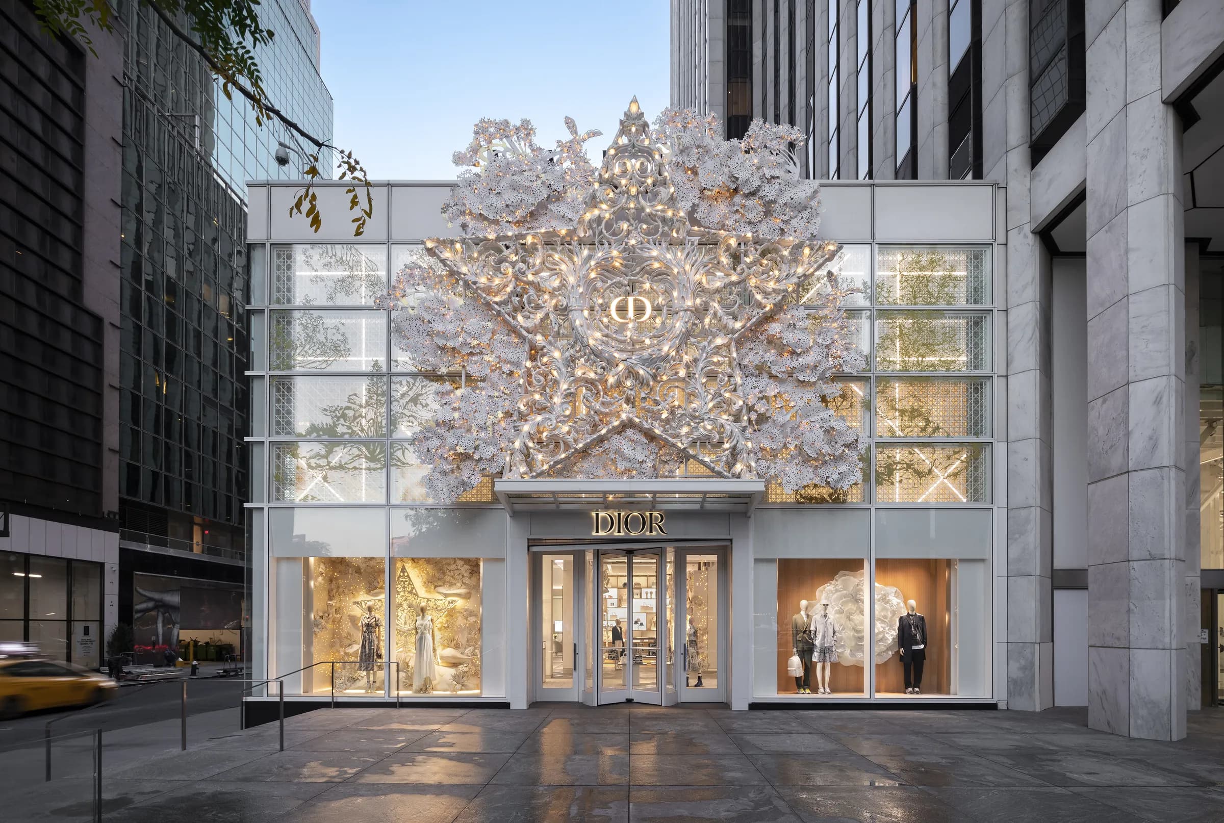 Dior boutique facade crowned with a sculptural white star installation above the entrance