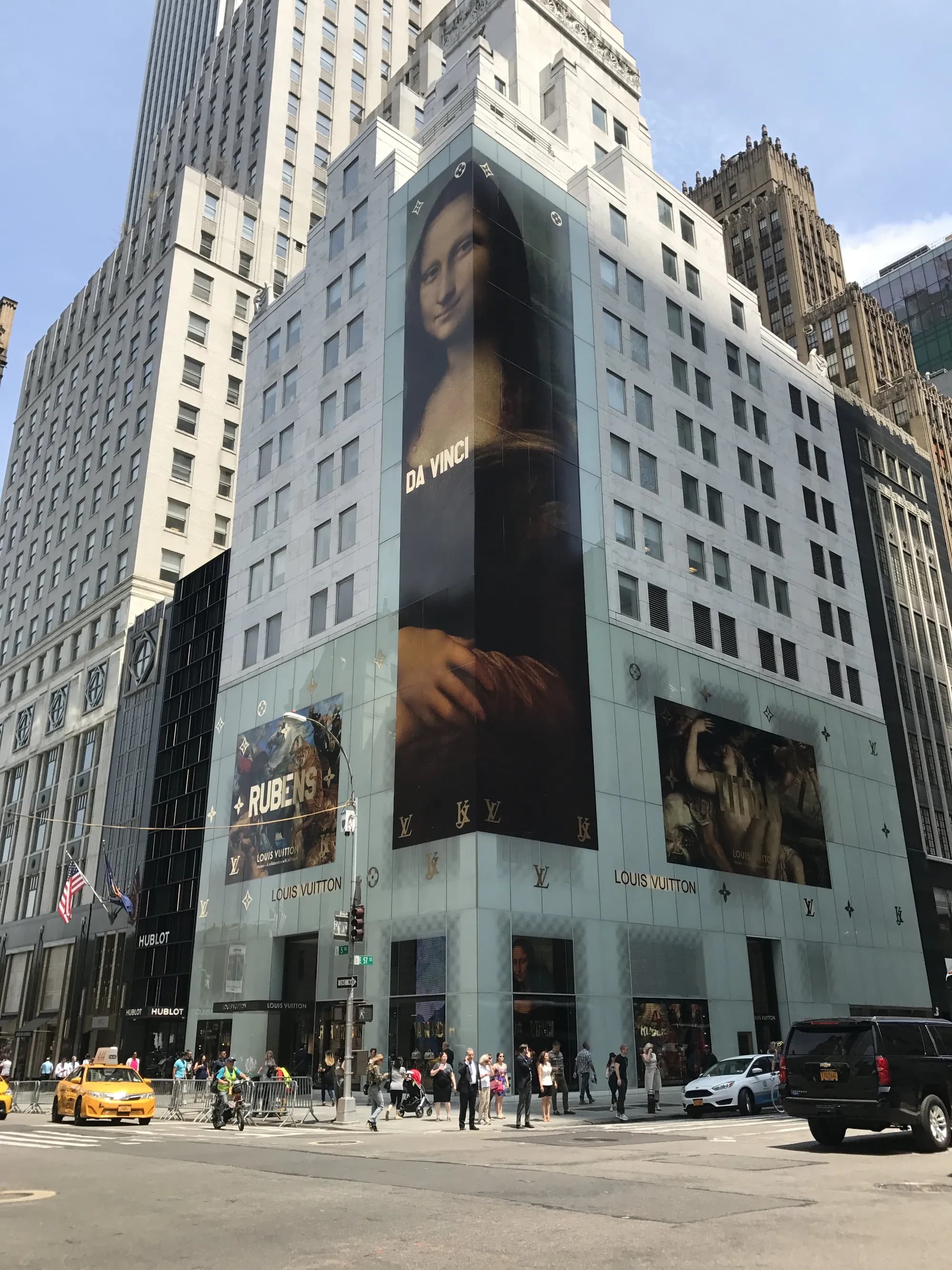 Louis Vuitton building wrapped with Old Master painting imagery from the Jeff Koons collaboration, 2017