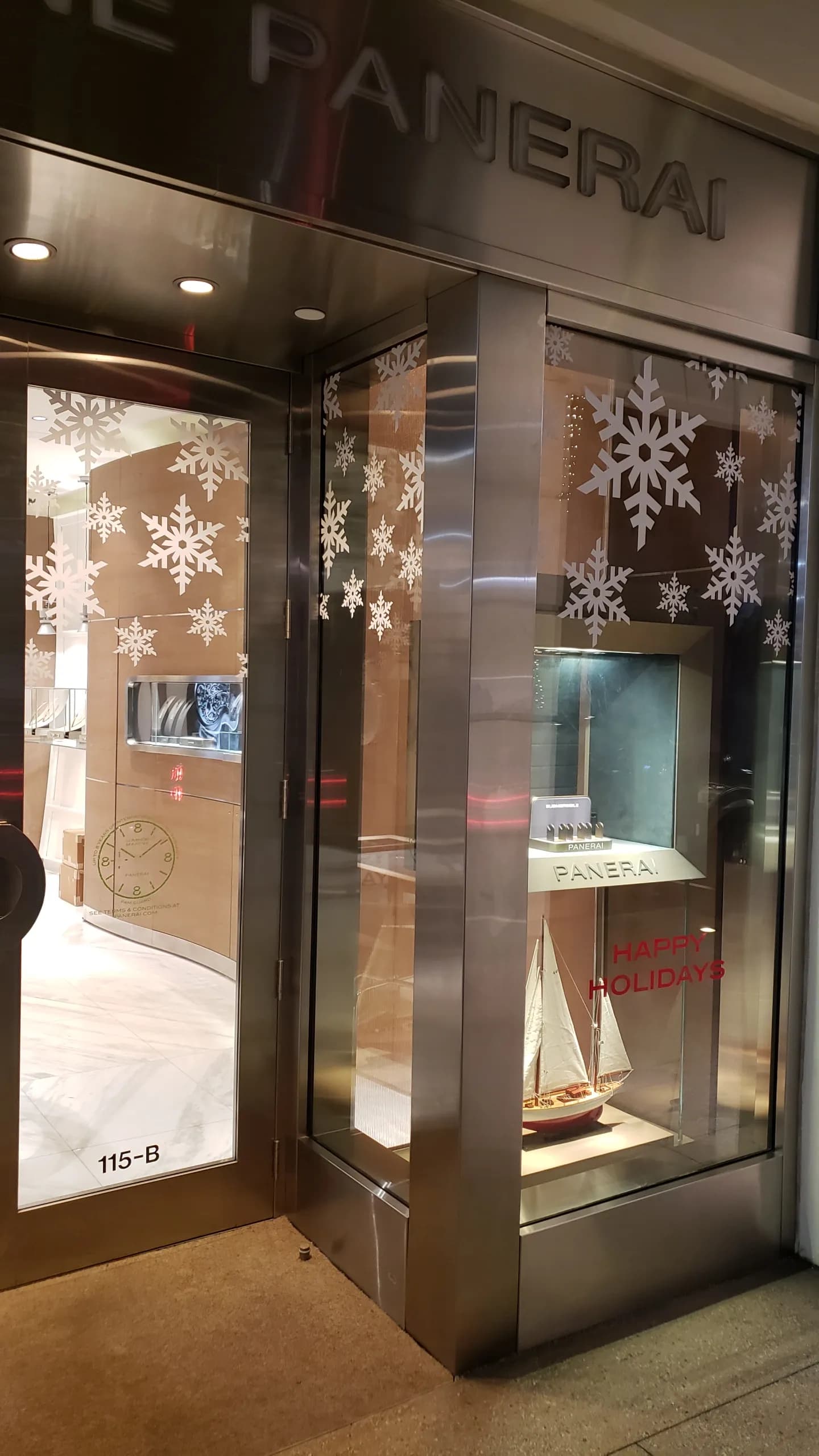 Panerai Palm Beach entrance at night with frosted snowflake vinyl on the glass