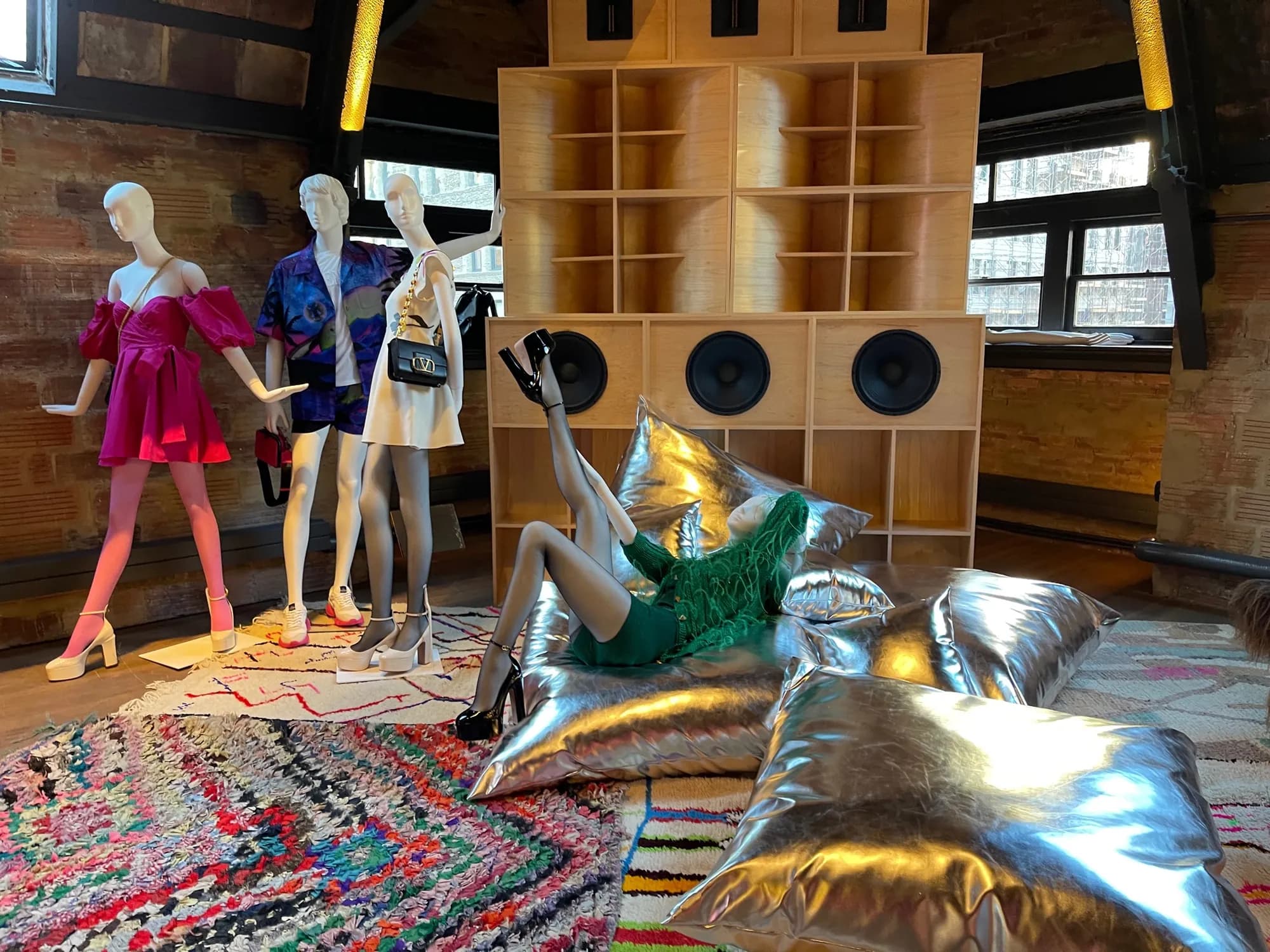 Valentino Party Collection lounge set with speaker wall, rugs and silver cushions at Fotografiska